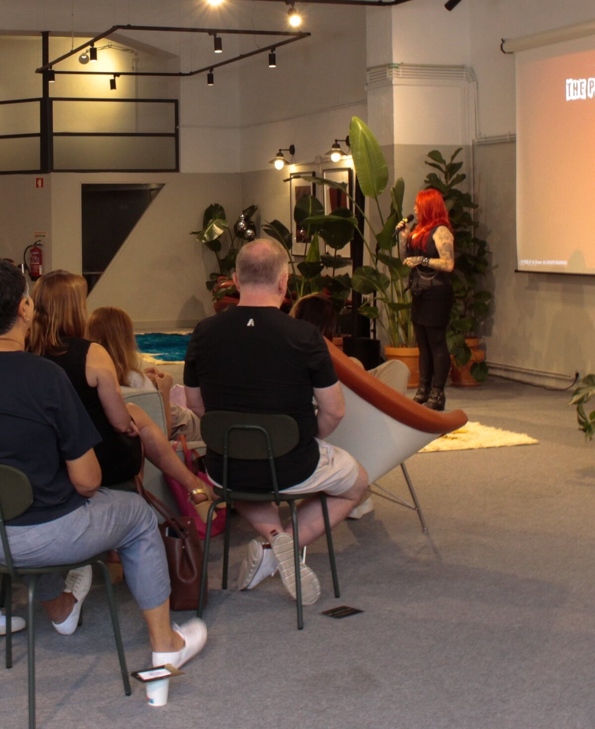 A full training room, Ronia Fraser presenting at the front