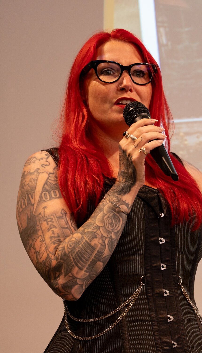 Ronia Fraser speaking with a microphone